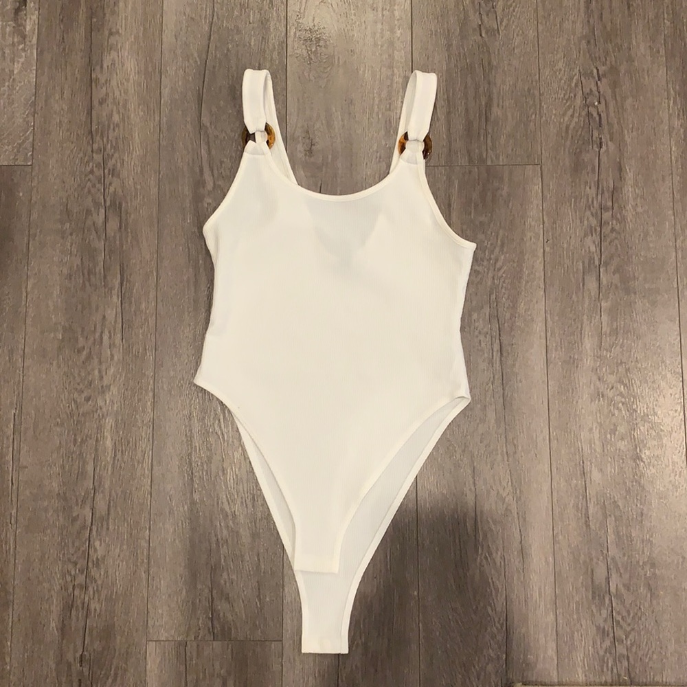 White body suit with tortoise shell